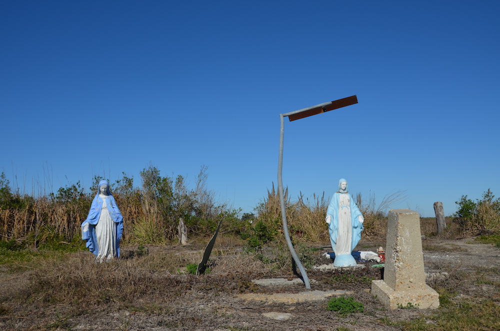 Virgin Mary statues in an empty field