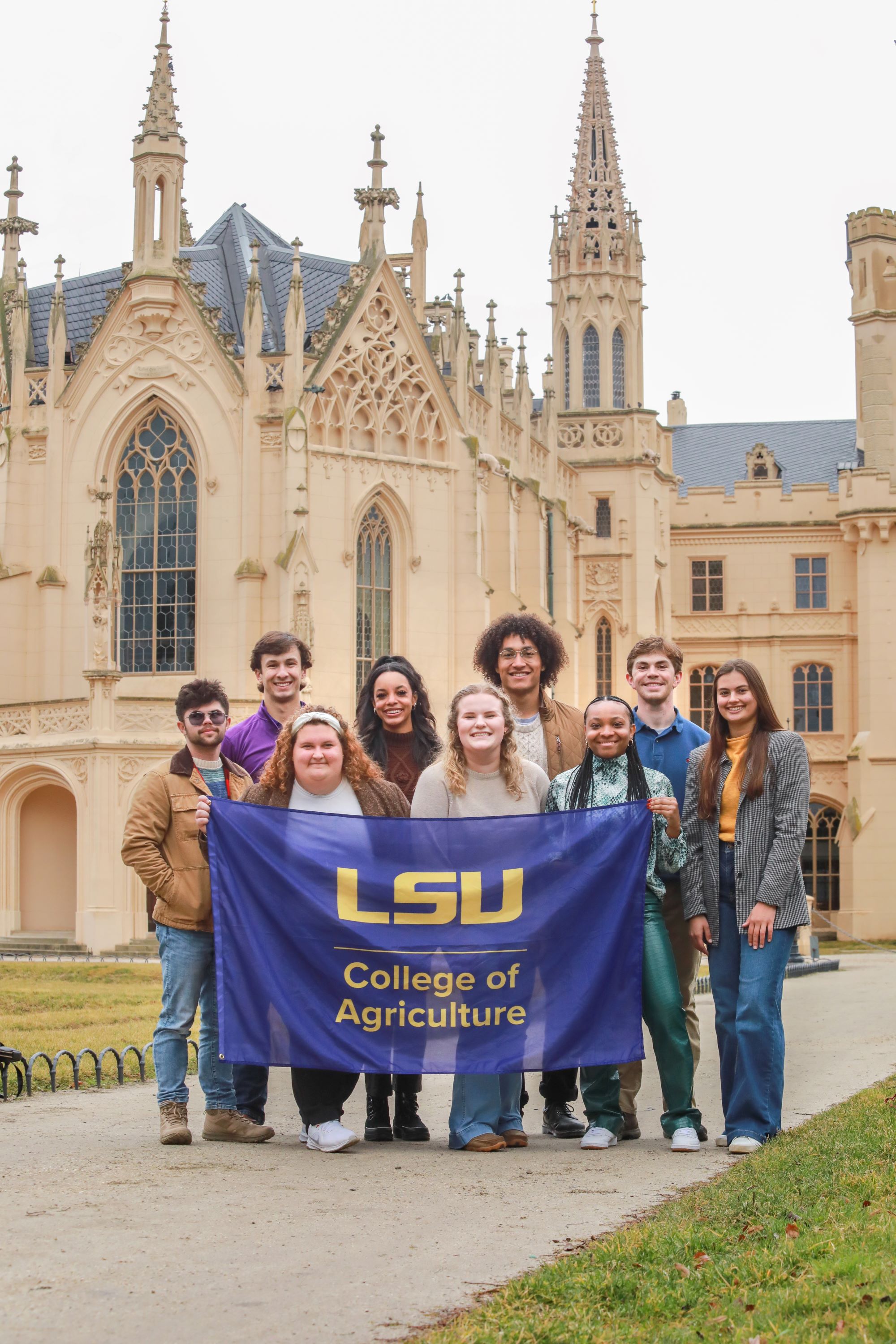 students hold LSU flagin Czech Republic