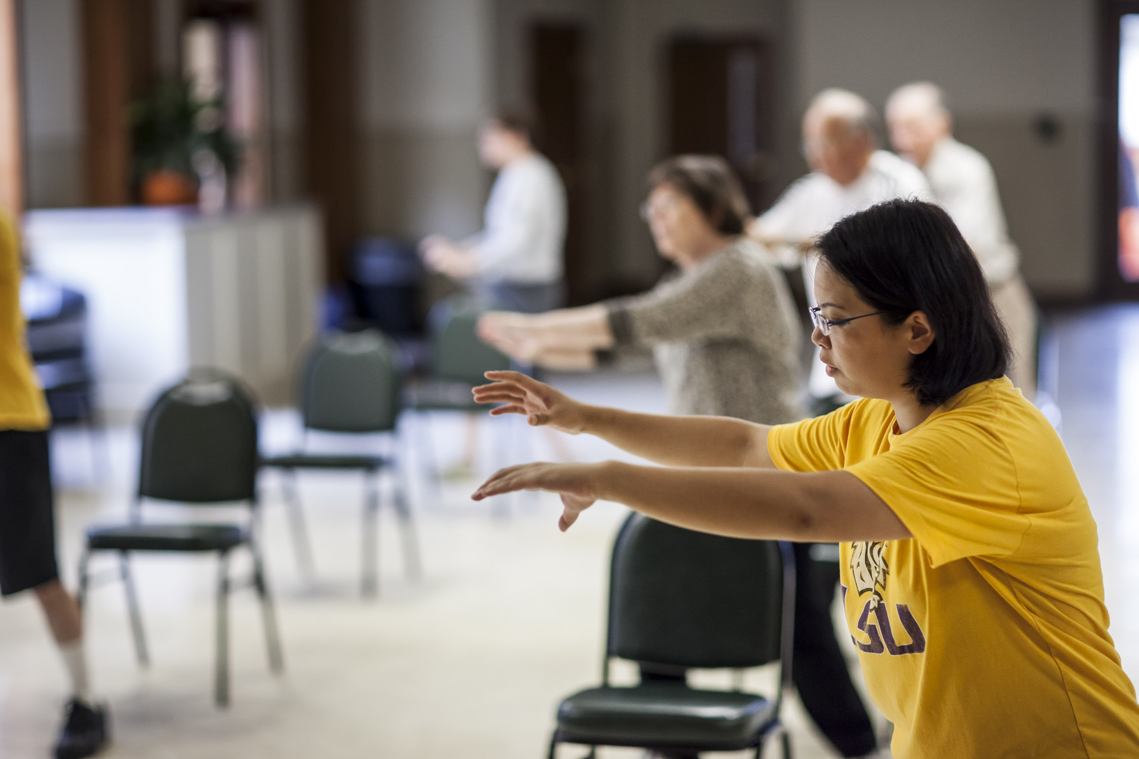 Woman taking a tai chi class