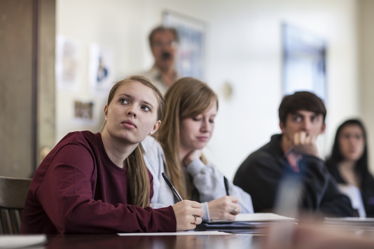 photo: student taking notes