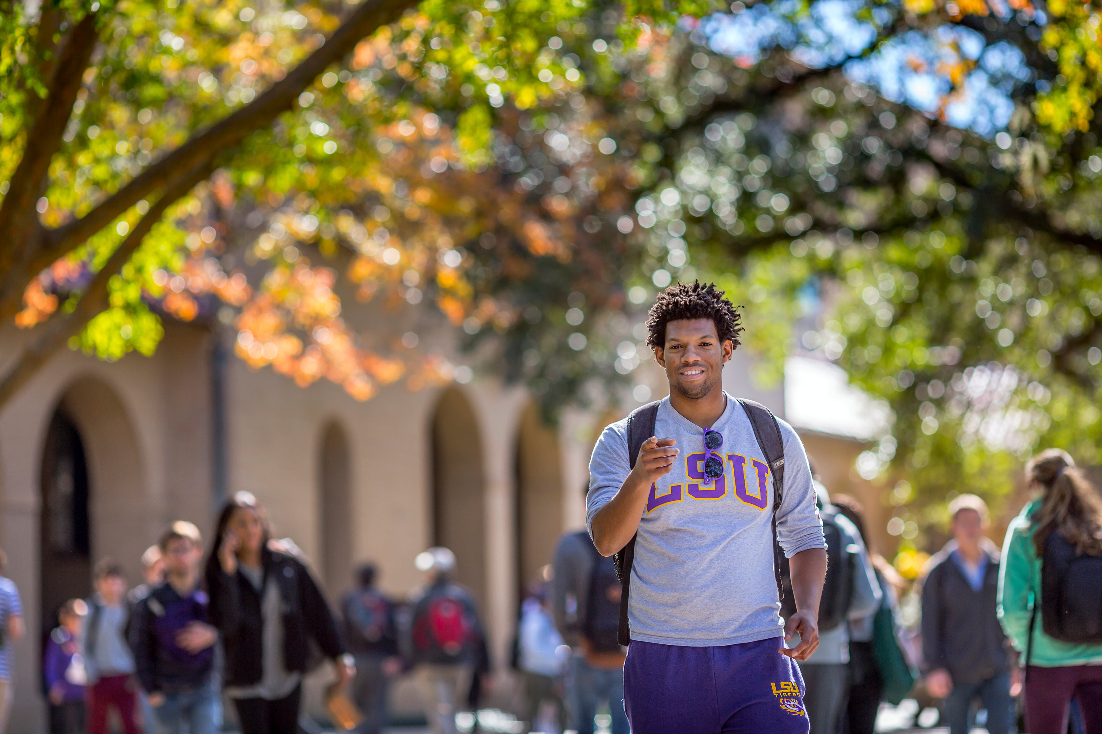 student walking through quad