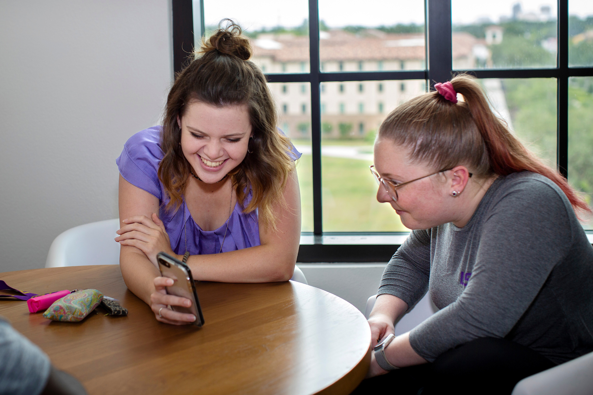 students looking at phone