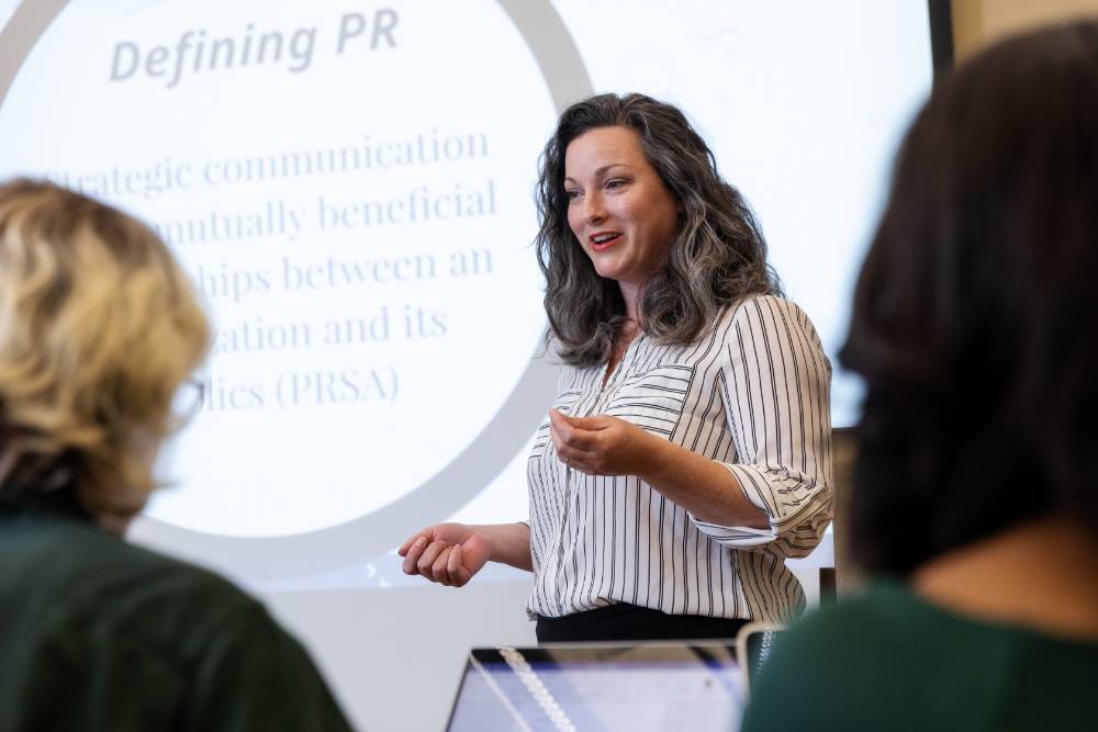 Manship School teacher presenting to a class