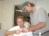 two scientists examining genetic resources sample