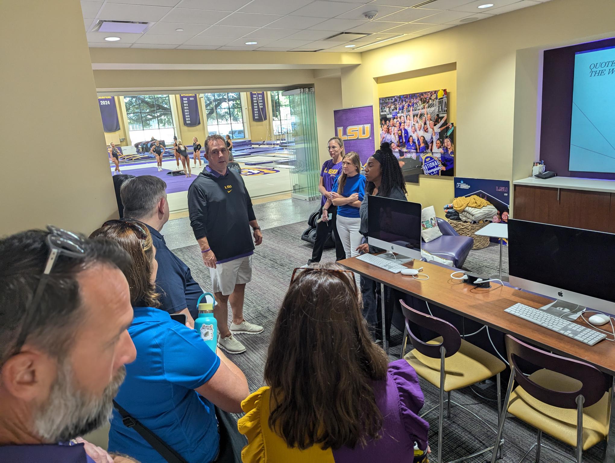 Math educators tour the LSU gymnastics facilities and discuss recruitment with reigning national champion Jay Clark.