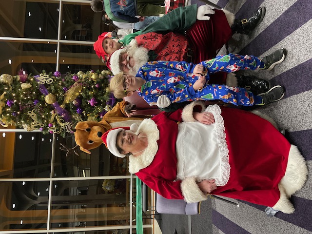 Santa Claus and Mrs. Claus with children