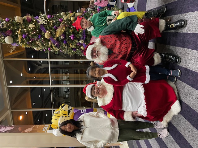 Santa Claus and Mrs. Claus with children