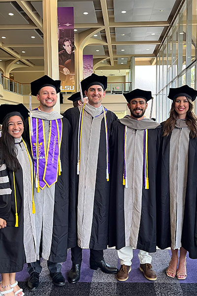 students in regalia at commencement